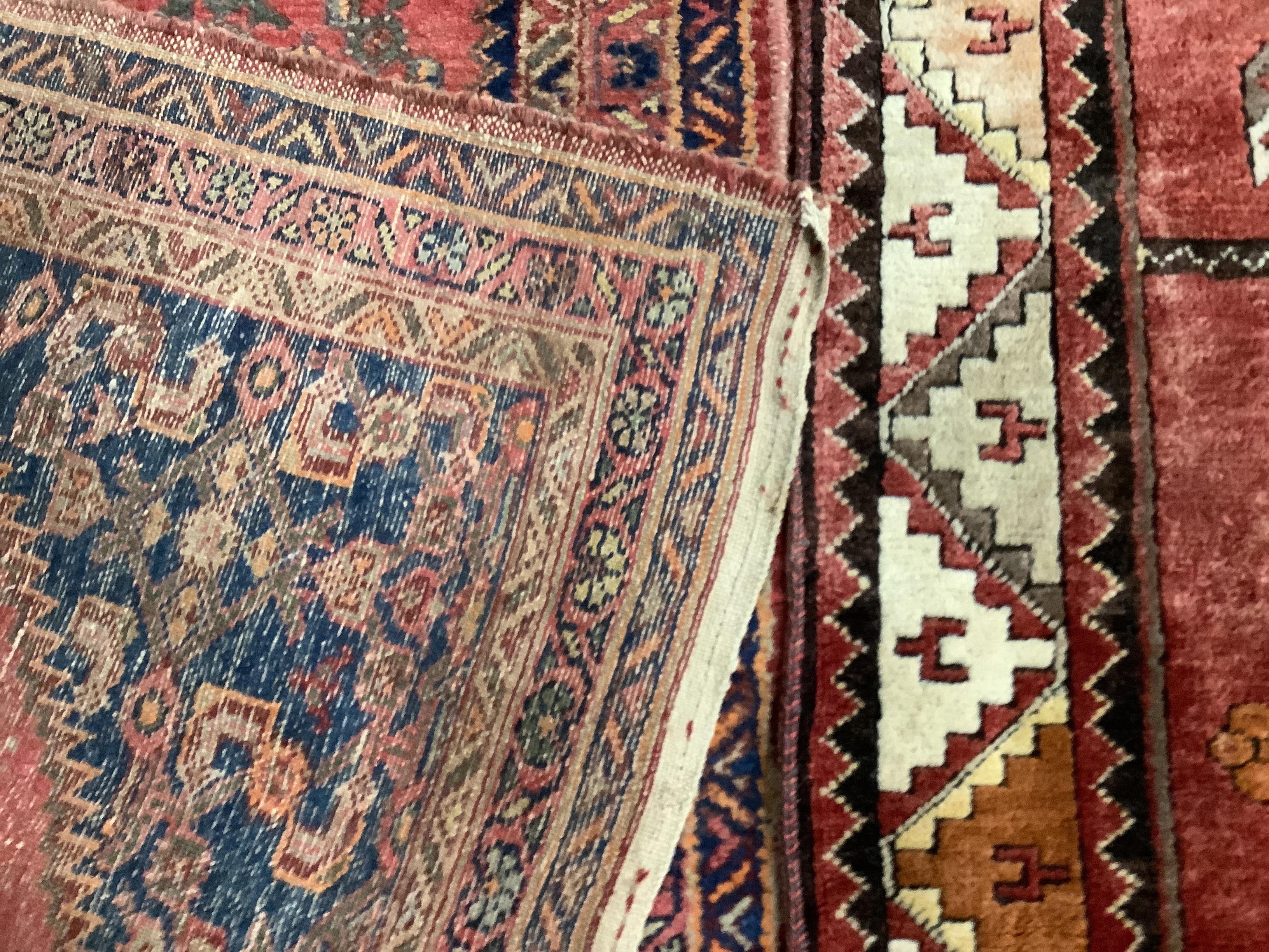 A Caucasian red ground rug, 197 x 120cm and a modern Caucasian style rug, 185 x 99cm